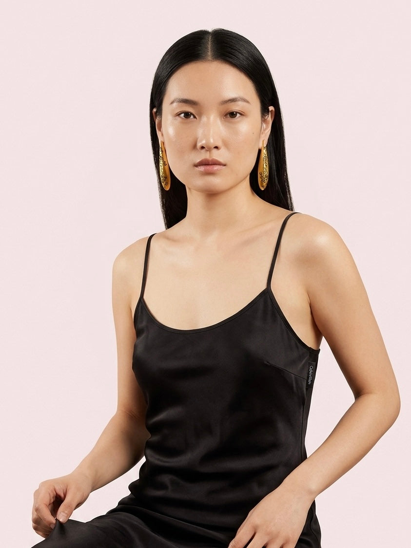 Engraved symbols long drop earrings