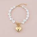Baroque natural pearls and heart pendant