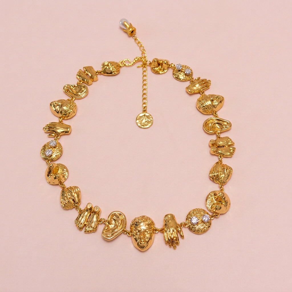 Surrealist Facial and Body Parts Necklace