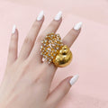 Anello aperto a forma di lumaca di mare con strass