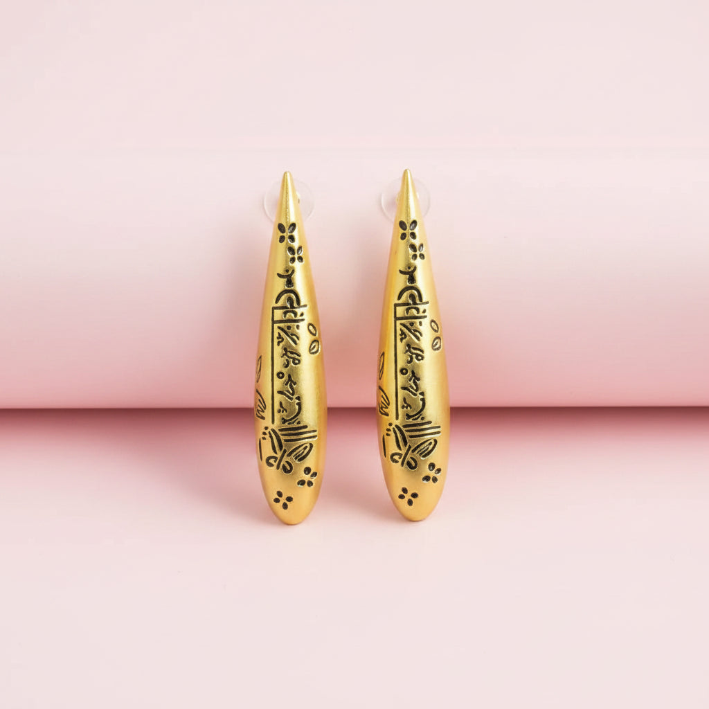 Engraved symbols long drop earrings