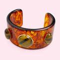 Natural Stone Wide Cuff Bracelet on a light pink background